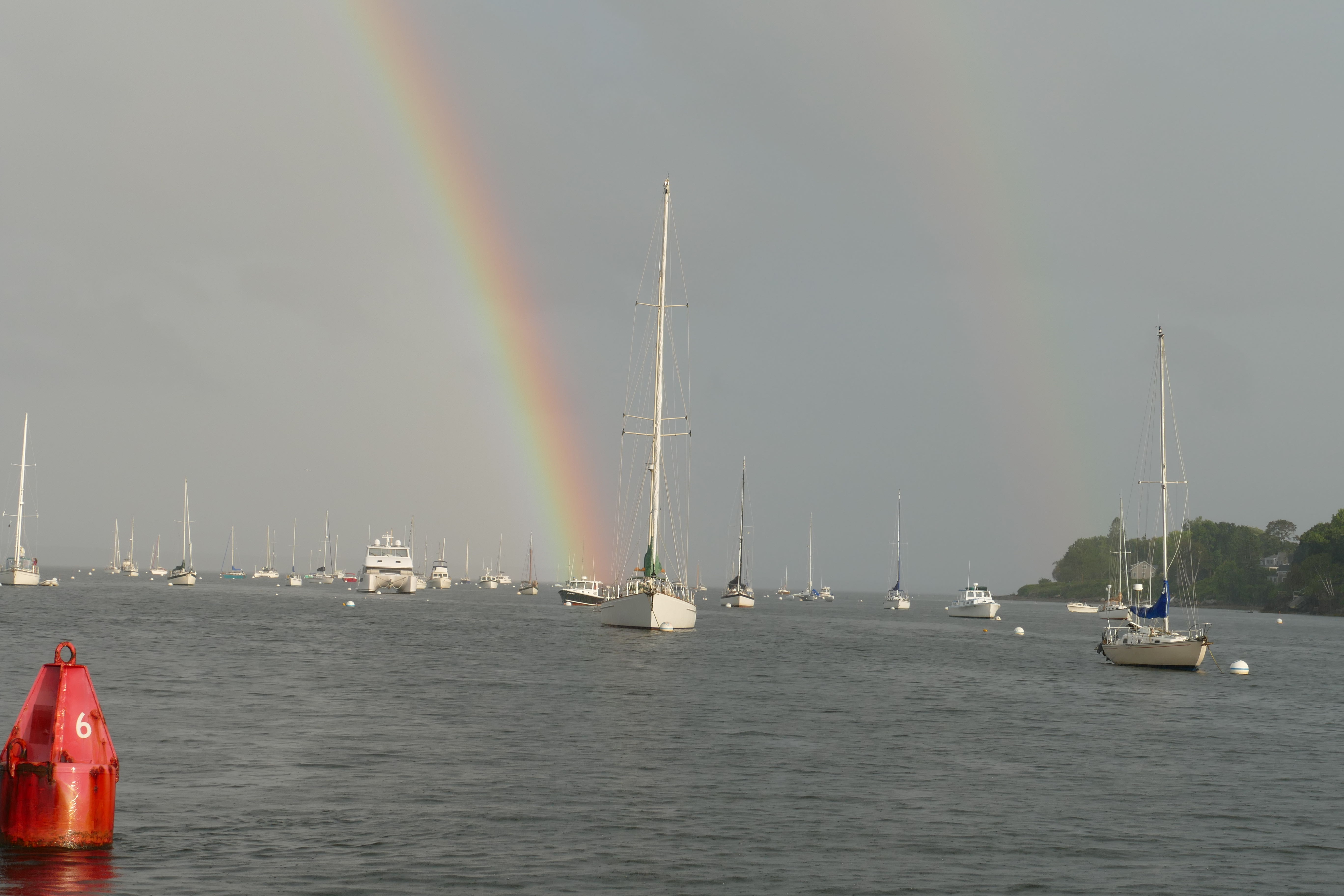 Double rainbow. The one on the left was a full rainbow but the camera couldn’t zoom out enough to capture it.