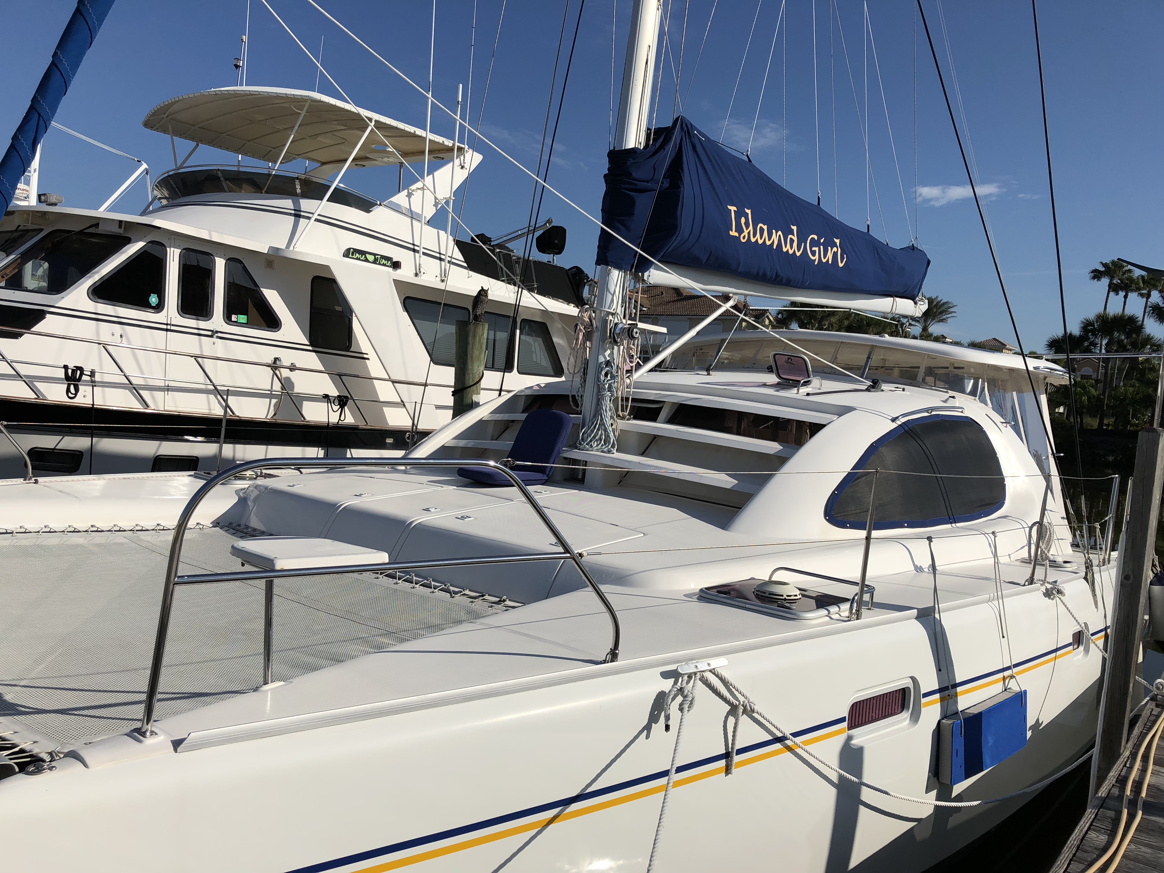 A picture of Current Life right after we bought her in Vero Beach. She looks very unhappy with her old name on the sail cover.